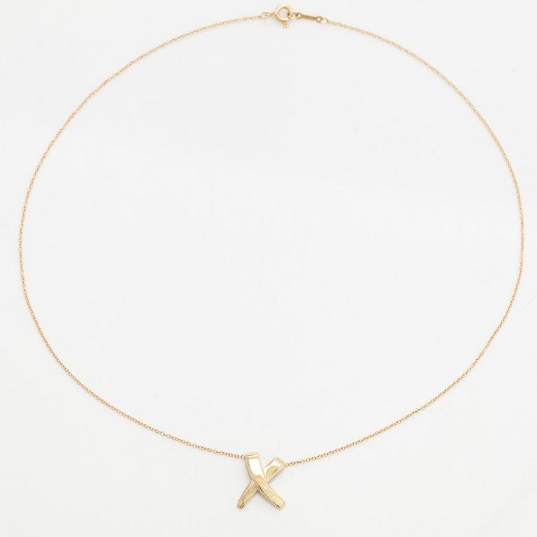 Tiffany & Co, Paloma Picasso, an 18K gold "X Kiss" necklace.