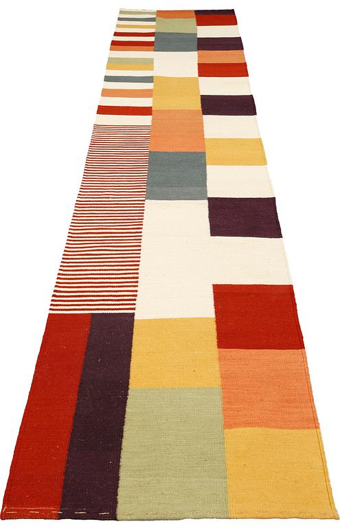 A  kilim runner, approximately 449 x 82 cm.
