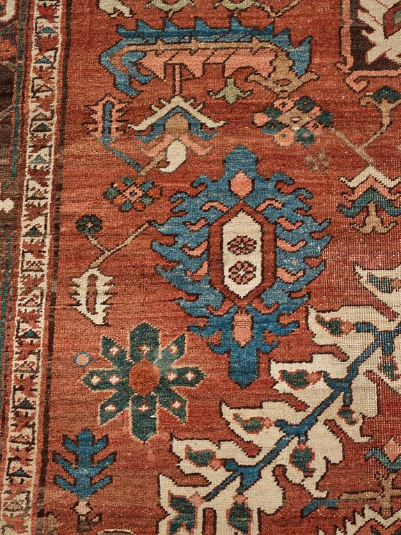 A carpet, an antique Heriz, ca 454,5-460,5 x 268-285 cm.