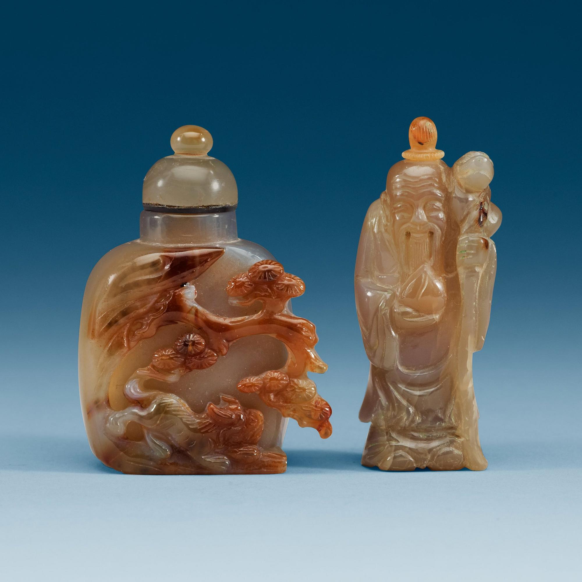 Two Chinese agate snuff bottles with stoppers.
