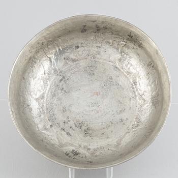 A west Asian repoussé silver and copper vessle, circa 1900.
