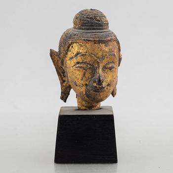 Two Thai gilt wooden fragments of figurines, late 19th century.