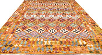 A kilim carpet, approximately 351 x 254 cm.