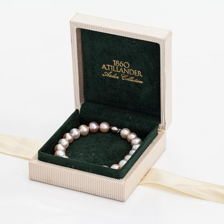 A cultured pearl bracelet with a sterling silver lock.