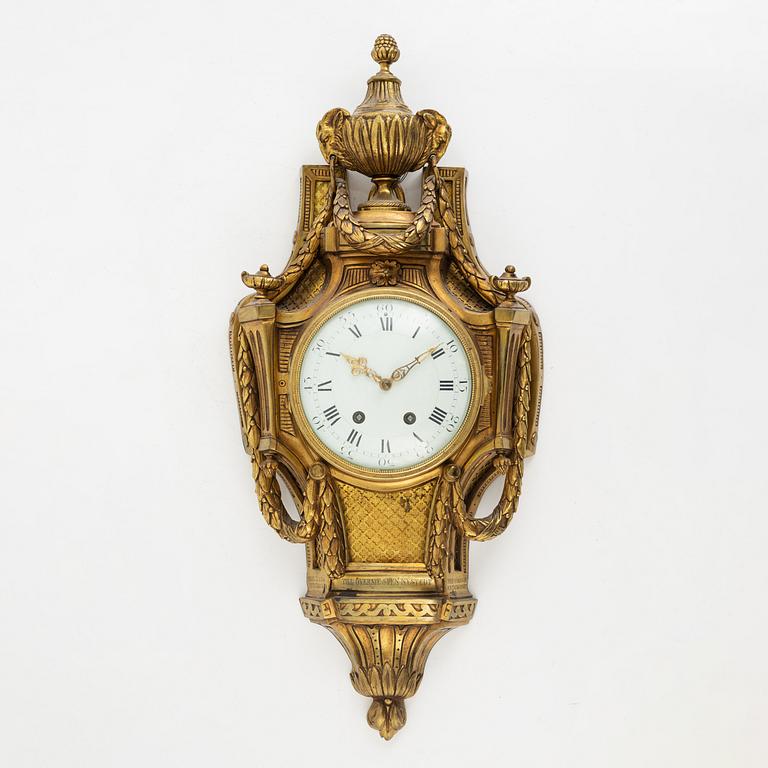 A Louis XVI-style wall clock, early 20th century.