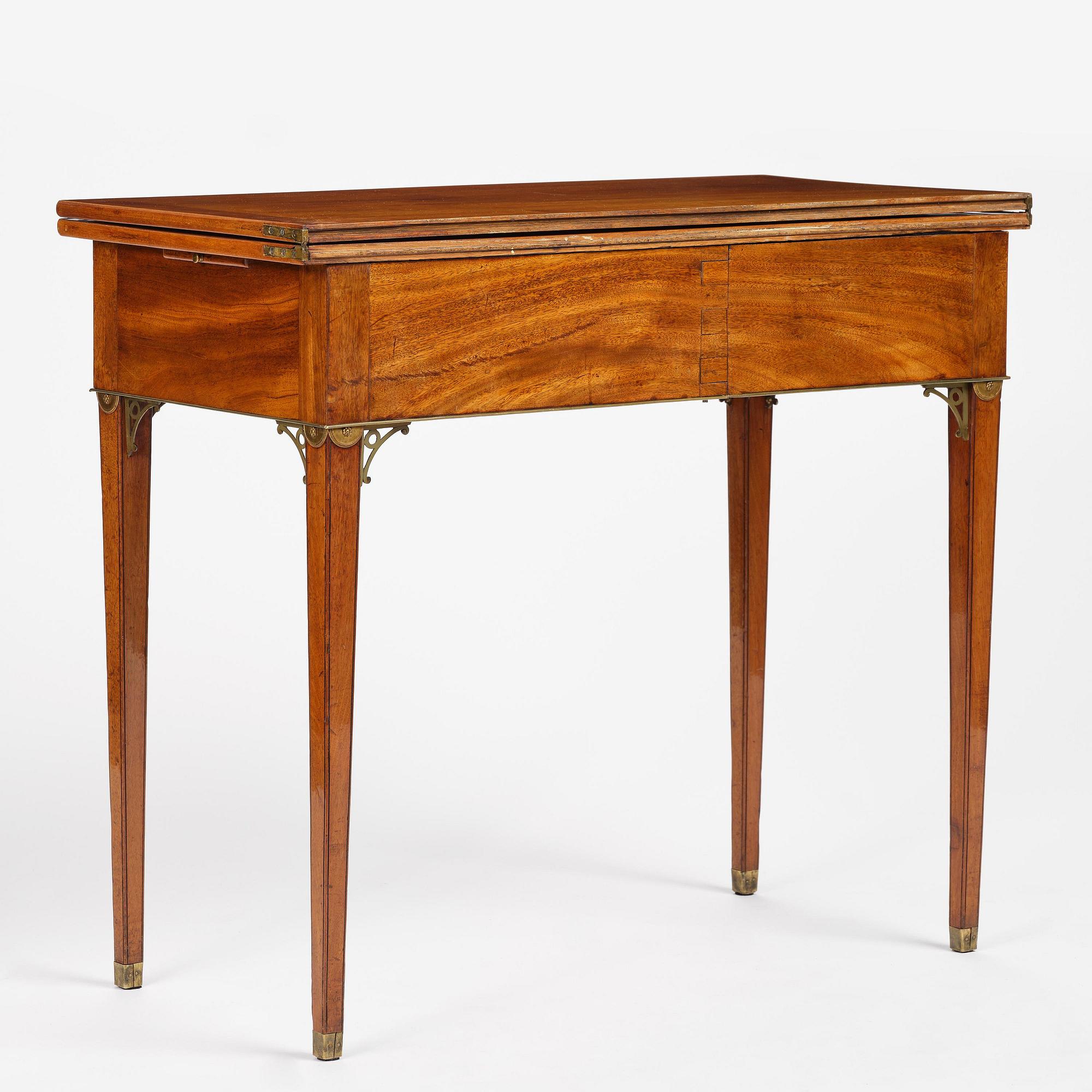 A late Gustavian mahogany games table, presumably by A. Nordström (Journeyman at G. Iwersson 1806-09).