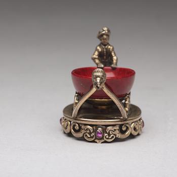 A Fabergé purpurin and silver salt-cellar, workmaster Erik Kollin, St. Petersburg before 1896. Scratched inventory no.