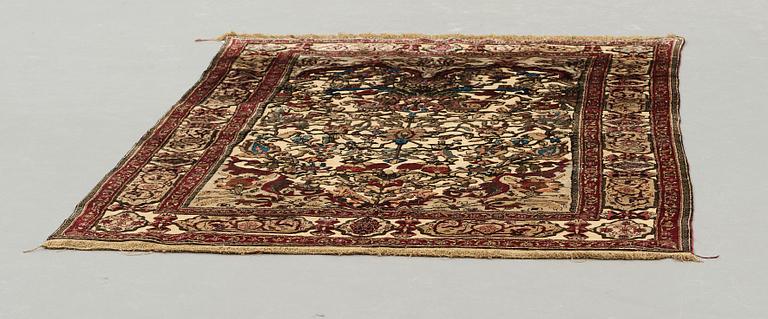 A RUG, a semi-antique silk Kashan relief (souf), ca 202 x 130,5-133 cm.