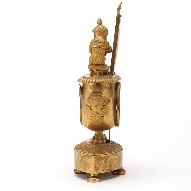 A French Empire early 19th century gilt bronze mantel clock.