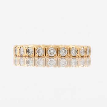 Ring in 18K gold set with round brilliant-cut diamonds, eternity band.