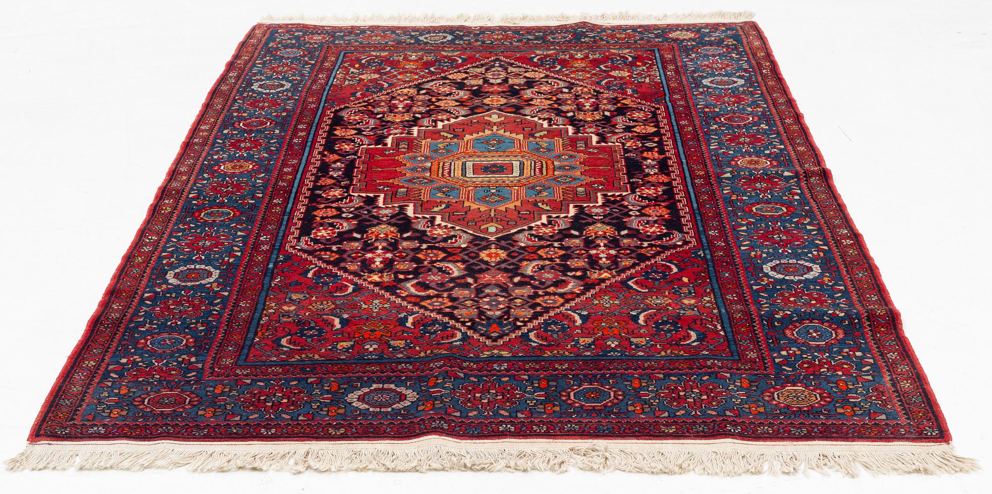An oriental rug, old, c. 204 x 139 cm.