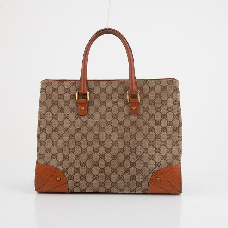 Gucci, a canvas and leather bag.