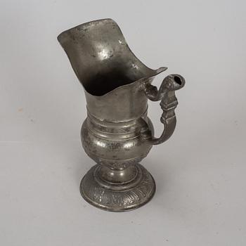 A pewter jug, probably 17th century.
