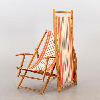 A pair of mid 20th century beach chairs.