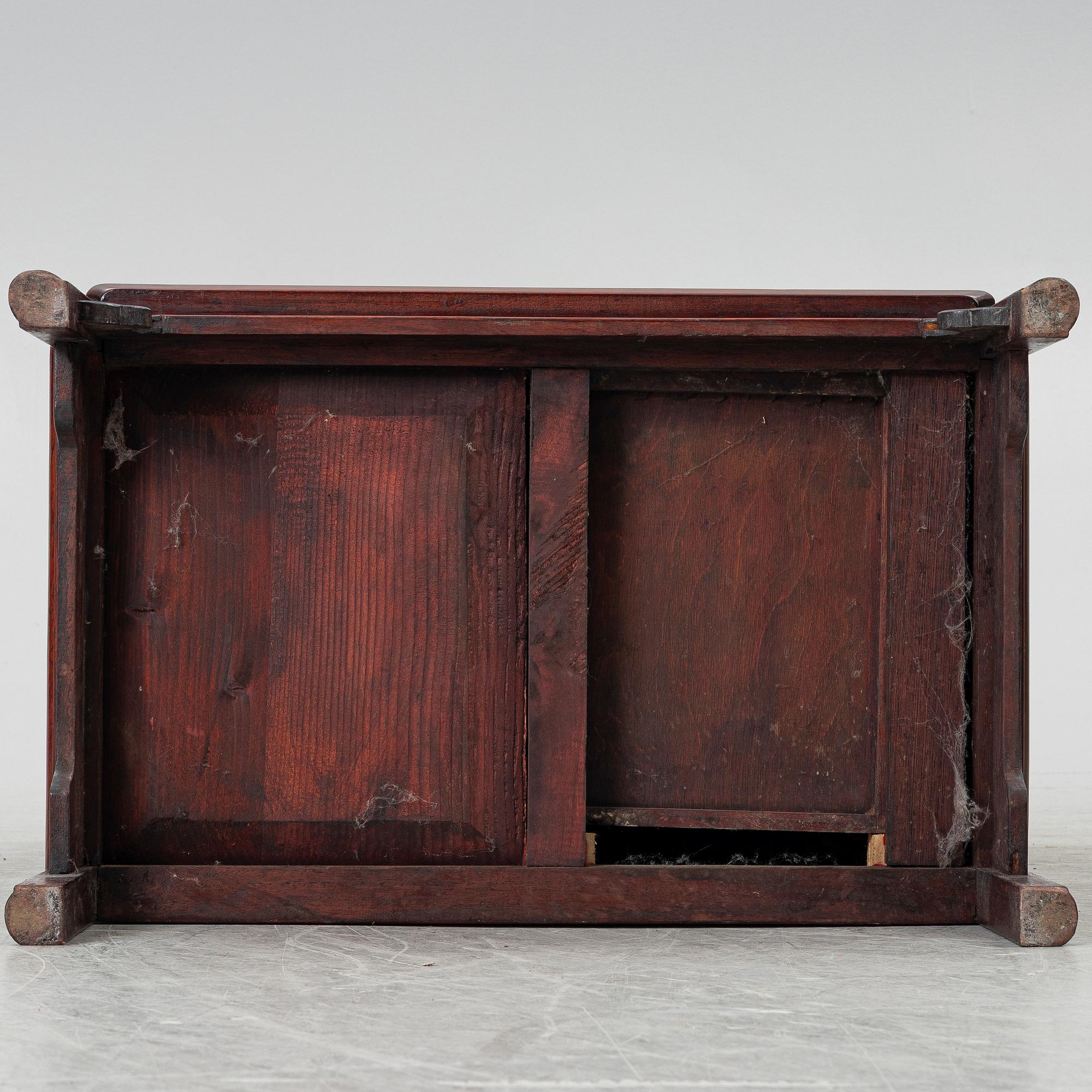 A small Chinese wooden cabinet, 1900s.
