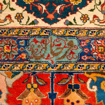 A carpet, a semi-antique Tabriz, ca 528-535 x 346,5-352,5 cm, signed Farhan.