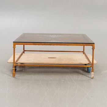 A late 20th century metall and glass coffee table.