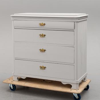 an early 20th century painted chest of drawers.