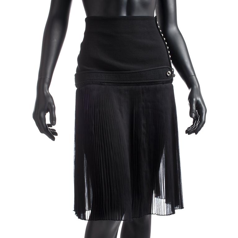 BALENCIAGA, a black wool blend and silk skirt.