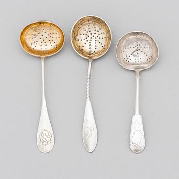 Three Russian silver tea strainer/ sprinkle spoons, late 19th to early 20th century.