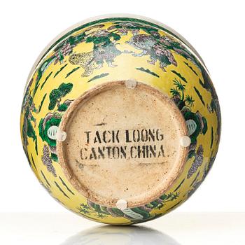 A large yellow ground famille verte bisquit jardiniere, Qing dynasty, 19th century. Marked 'Tack Loong Canton China'.