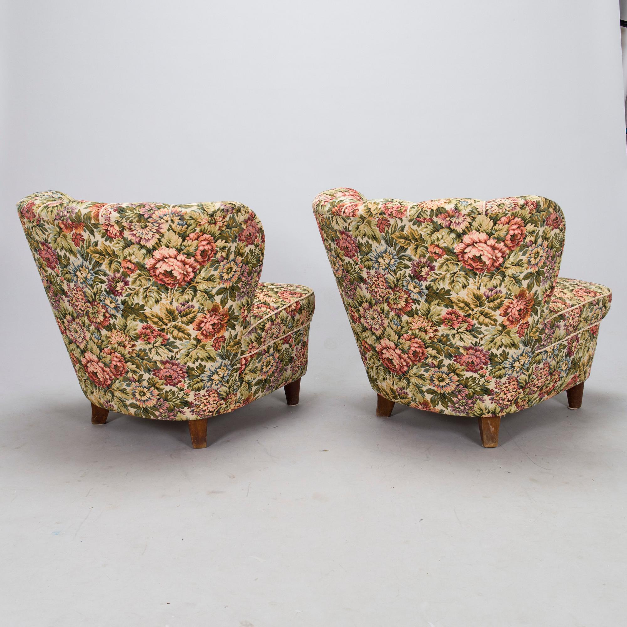 A pair of mid-20th-century armchairs.