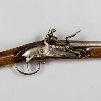 A late 18th century flintlock rifle.