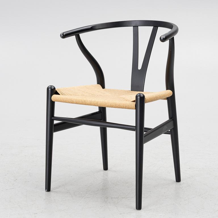 Hans J. Wegner, a model CH-24/'Wishbone' chair, Carl Hansen, Denmark, 21st century.