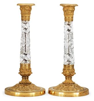 1280. A pair of Russian circa 1830 gilt bronze and glas candlesticks.