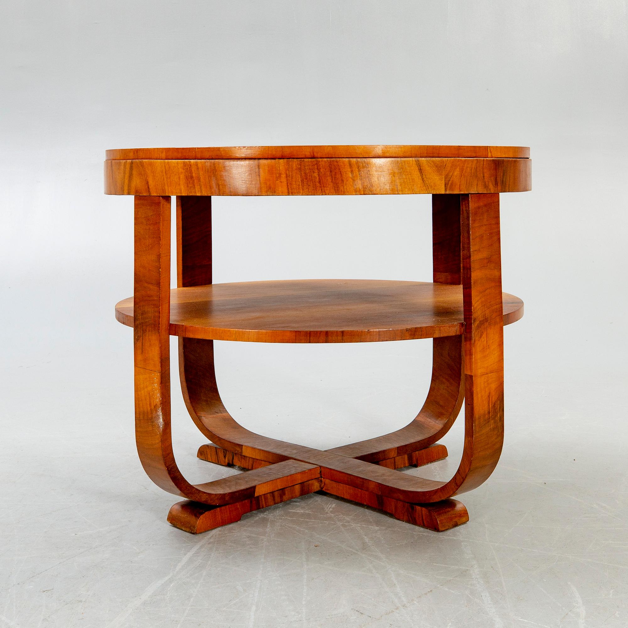 An Art Deco style walnut coffee table later part of the 20th century.