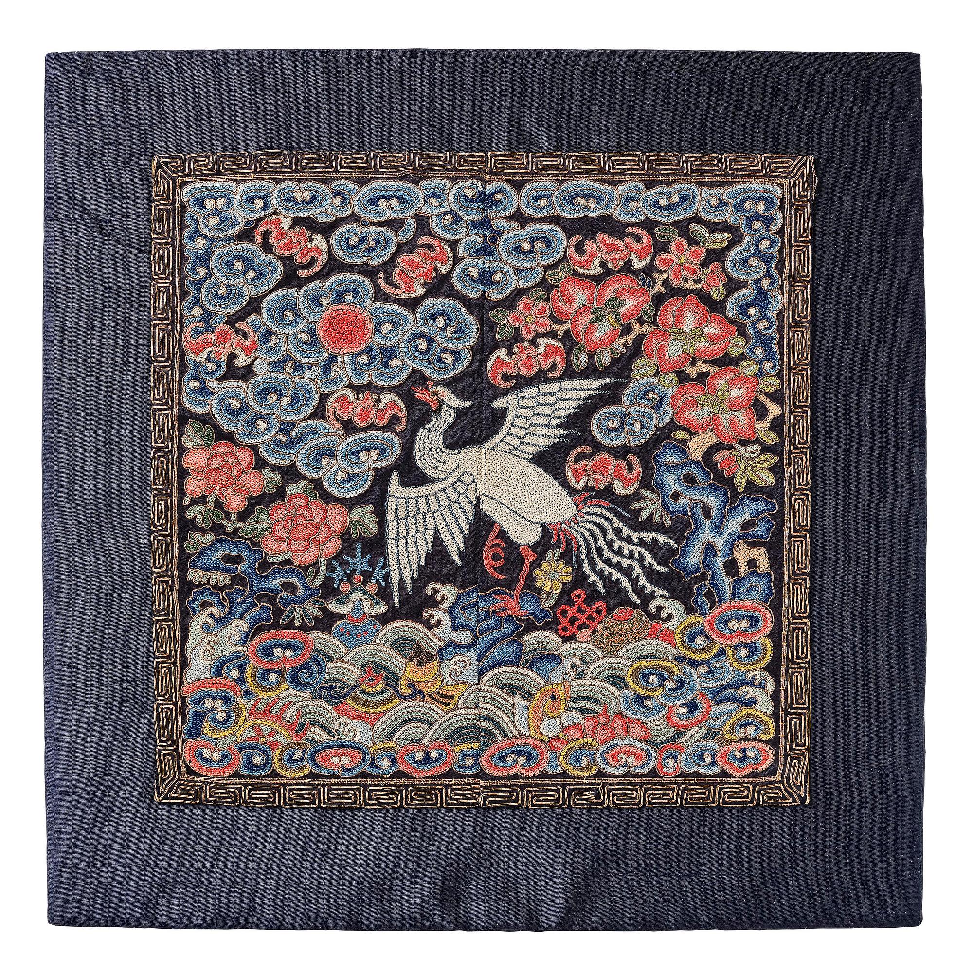 An embroidered civil official's rank badge with a silver pheasant, Qing dynasty, Tongzhi period (1862-1874).