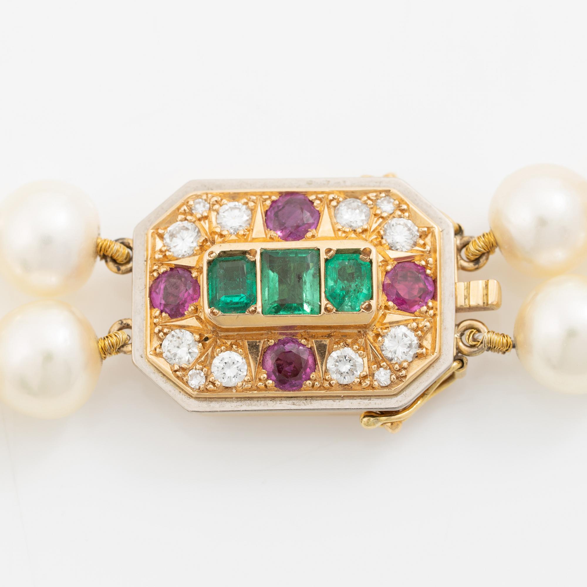 Pearl necklace, two-stranded, with a clasp by Seblings in 18K gold set with emeralds, rubies, and brilliant-cut diamonds.
