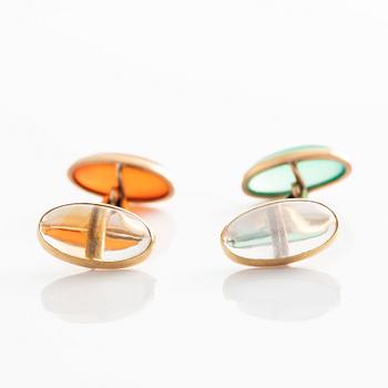 Manschettknappar guld med cabochonslipade färgstenar.