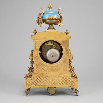 A late 19th Century bronze and porelain mantel clock.