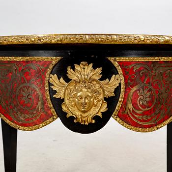 A Boulle style table around 1900.