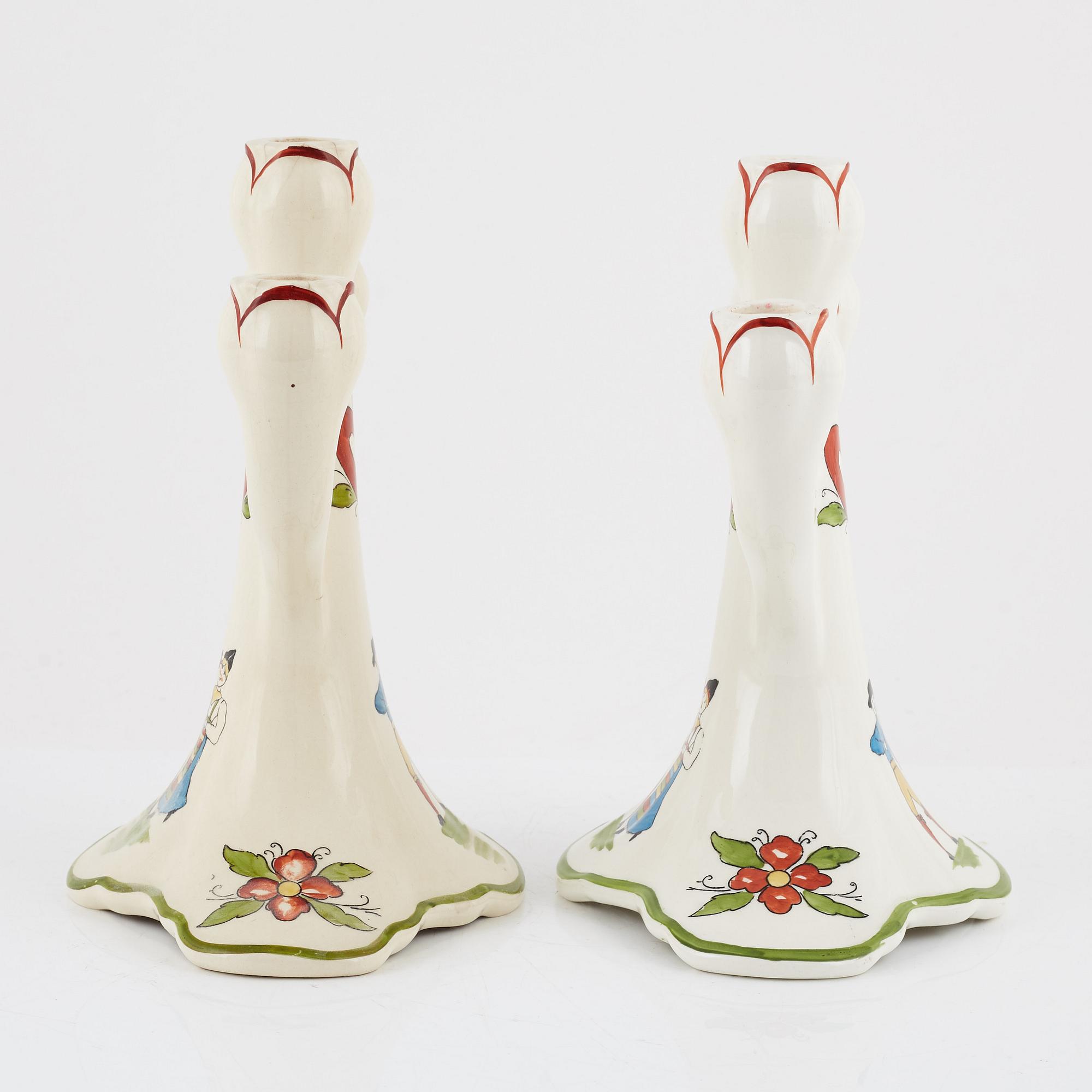 A pair of 'Daladansen' creamware candelabra from Rörstrand, Art Nouveau, early 20th Century.