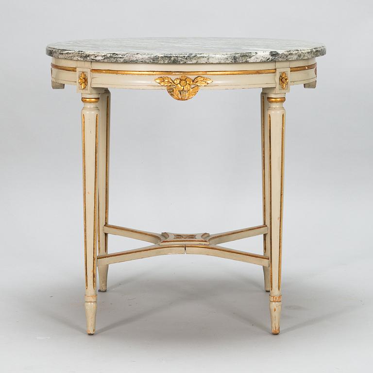 A Gustavian style sofa and table from early 20th century.