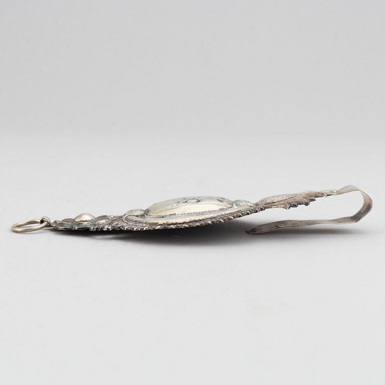 A pair of 19th century silver curtain tie-backs.