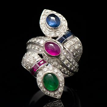 A RING, cabochon cut emerald, ruby and sapphire, brilliant cut diamonds, 18K white gold.