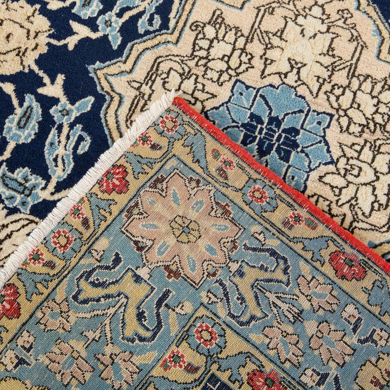 An old Shahreza carpet ca 221 x 138 cm.