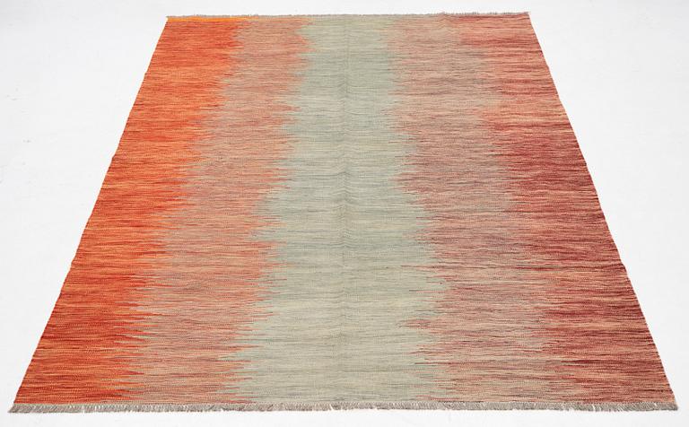 A kilim carpet, 304 x 203 cm.