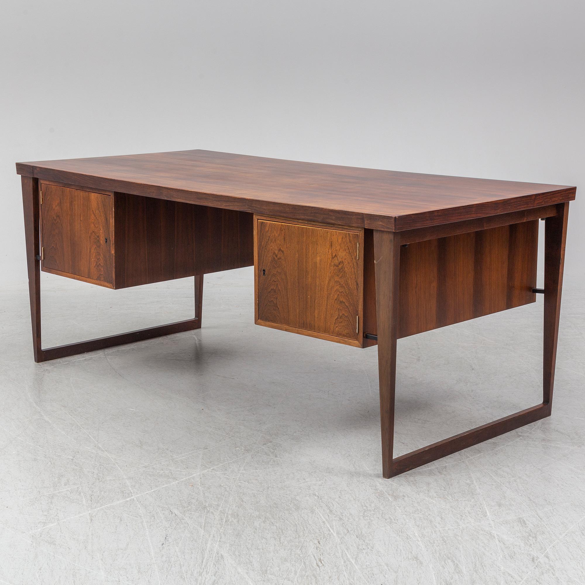 A 1960's rosewood desk by Kai Kristiansen, Feldballes Møbelfabrik, Denmark.
