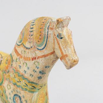 A painted Swedish wooden horse from the first half of the 20th century.