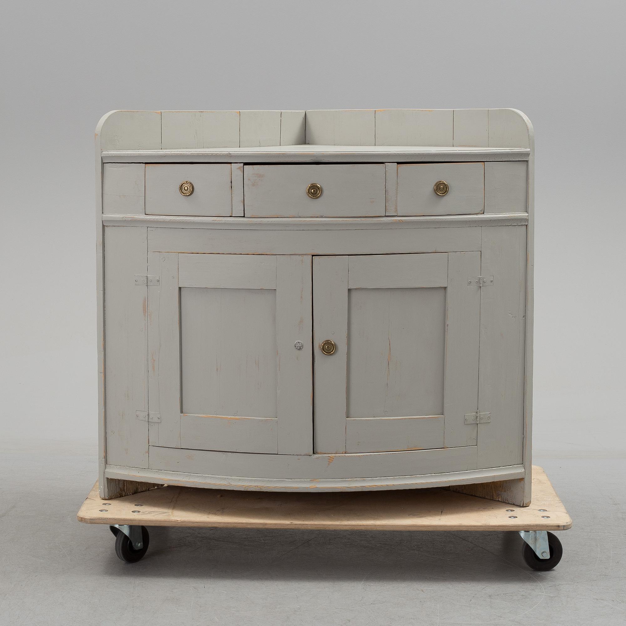 A mid 19th century corner sideboard.