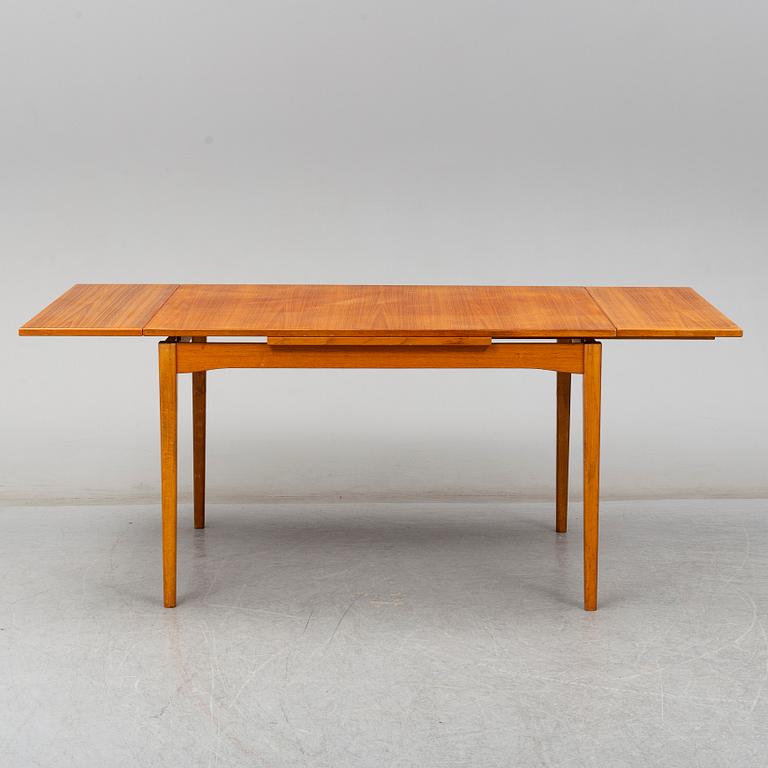 A second half of the 20th century teak veneered dining table.