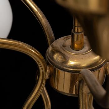 A brass and glass ceiling lamp for ten lights, first half 20th century.