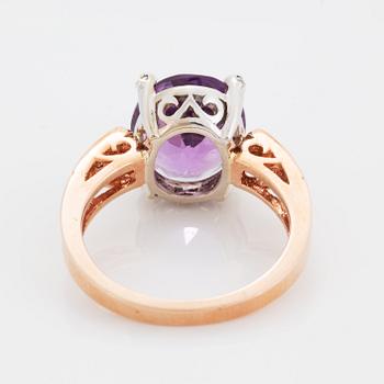 Oval faceted amethyst and brilliant-cut diamond ring.