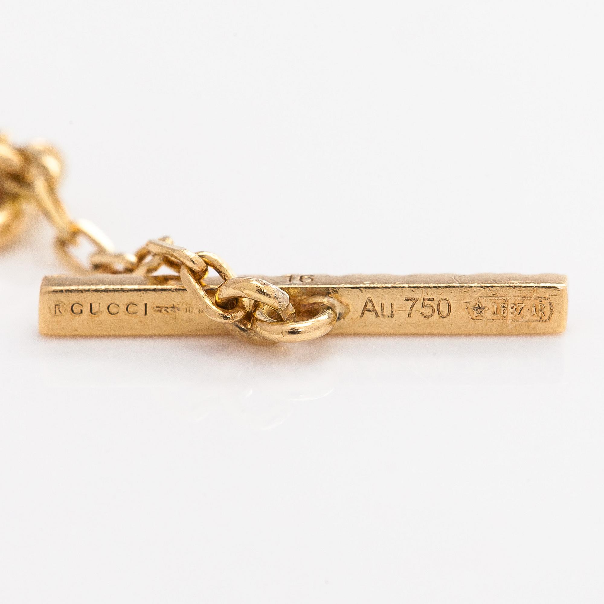 Gucci, an 18K gold 'Interlocking' bracelet with brilliant-cut diamonds.