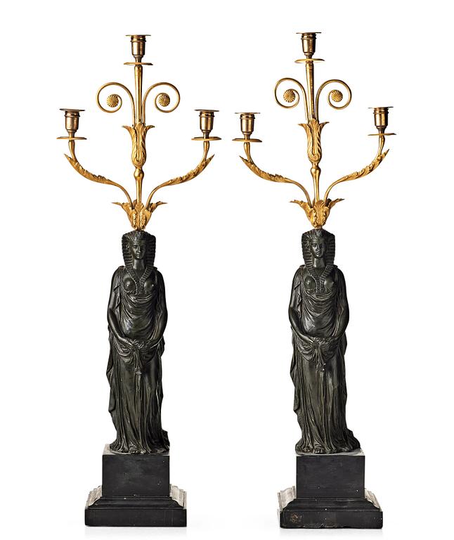 A pair of French Empire early 19th century three-light candelabra.