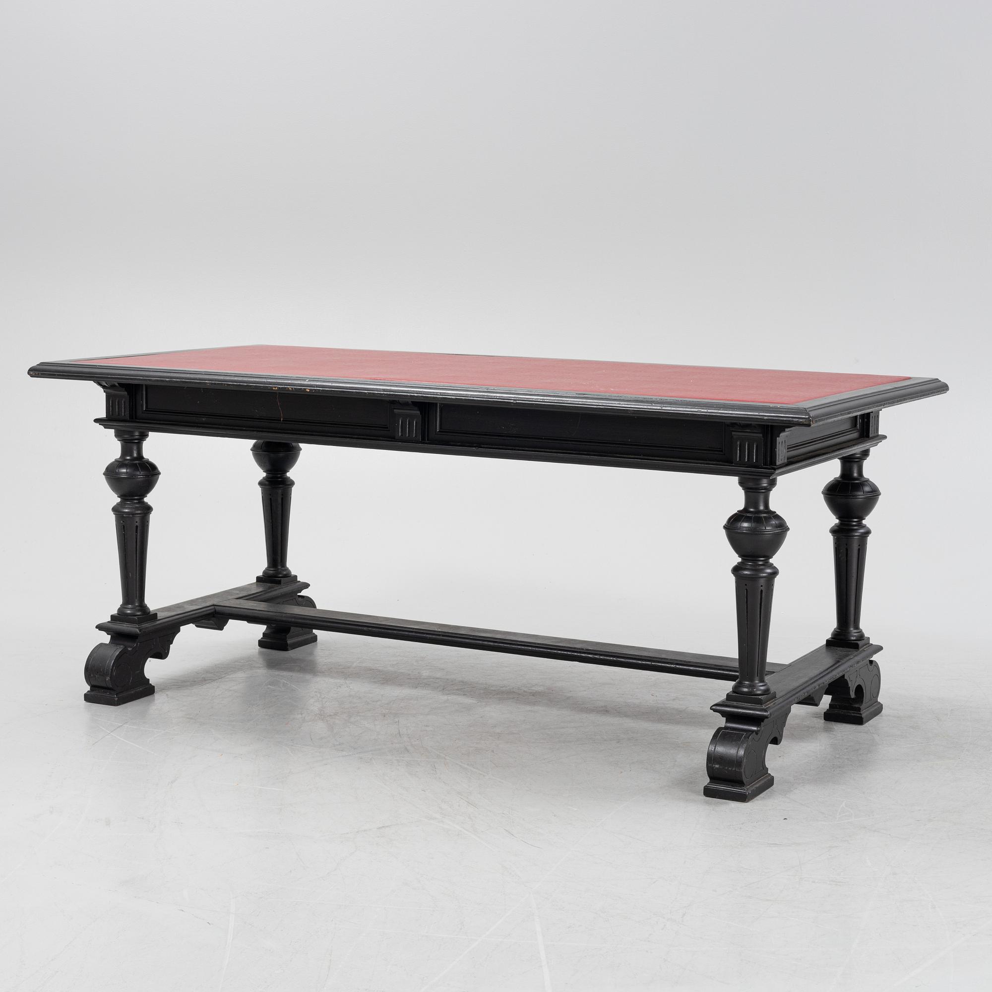 A renaissance style library table, around 1900.
